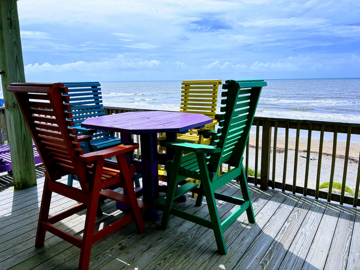 Colorful deck chairs overlooking the ocean at Gone Fishin'